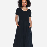 Woman wearing a black dress on a white background