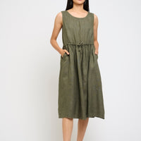 Woman wearing a green dress on a white background