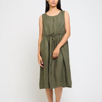 Woman wearing a green dress on a white background