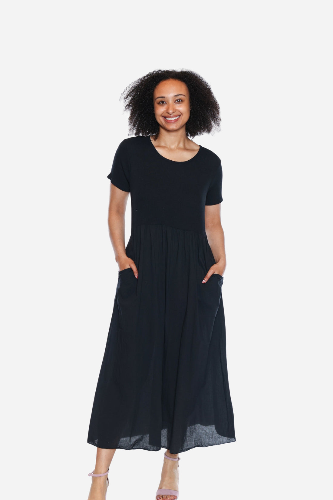 Woman wearing a black dress on a white background