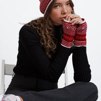 Model wears Norlender Adult's Multihat in Red on a white background.