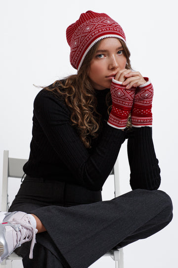 Model wears Norlender Adult's Multihat in Red on a white background.